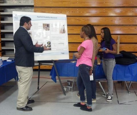 Nagmesh Kumar presents research to Sandy Springs Students