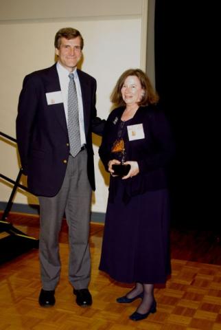 Dr. Benkeser presents Women of Distinction Award t