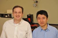 ECE Associate Professor John Papapolymerou (l) wit