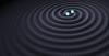 Depiction of two black holes merging (Credit: LIGO)