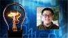 Square photo headshot of Georgia Tech 2023 Apple Scholar Jay Wang at right on digital binary blue field with illuminated transparent light bulb overlay at left 