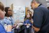   Students in Thomasville, Ga. explain their invention to a competition judge as a part of Georgia Tech’s expanding K-12 InVenture Prize program. 