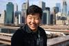 Richard Lee, cofounder of Supercopy, smiles in the sunlight, on a bridge in Atlanta