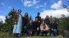 Group photo of researchers in an apple orchard