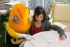 Buzz and a female undergraduate student work on an assignment together.