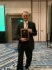 Photo of ECE Professor Deepakraj M. Divan with the 2023 Nari Hingorani Custom Power Award plaque.