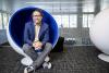 Michael Best, executive director of the Institute for People and Technology, seated in a round chair.