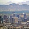 A view of Phoenix, Arizona with downtown, South Mountain, and a Southwest Airlines jet in frame.