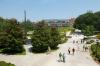 People walk along the Tech Green Walkway