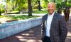 Raheem Beyah standing in Harrison Square with the Three Pioneers statue in the background.