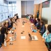 Group of people around a conference table.
