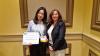 Ph.D. candidate Jingyuan Zhang (left) receiving the award from Damla Turgut (University of Central Florida), a steering committee member of this year’s Conference on Local Computer Networks.