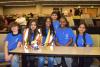 Middle school students pose with their robot at First LEGO League State Finals.