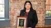 Director of Facilities and Capital Planning Priti Bhatia holding the APPA 2023 Pacesetter Award