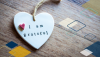 A small heart shaped piece with "I am grateful" written in typewriter-like font.