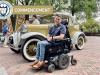 Trey Quinn poses next to the Ramblin' Wreck after a race. 