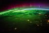 view of Earth from space, with auroras