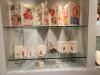 Accordion-folded paper objects in display case