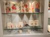 Accordion-folded paper objects in display case