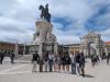 Group photo outdoors in front of statue.