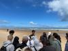 Group photo near beach.