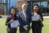 Undergraduate students Diya Godavarti and Waynell Simbafo with their mentor, chemistry graduate student John Pederson