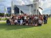 FYSA student group photo in front of the Mercedes Benz stadium.