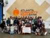 FYSA student group photo in front of Atlanta Community Food Bank signage.