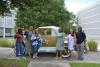 K12 InVenture Teachers posing next to the Ramblin Wreck at Georgia Tech Savannah.