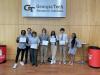 High School Students holding their internship completion certificates. Kala Jordan from IPAT pictured far right.