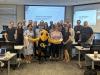 The Georgia Tech mascot Buzz joined the faculty in a group picture for the Annual Faculty Retreat