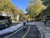 Person using a micromobility vehicle in the cycle track.