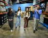Students walking through the food bank with the executive director.