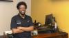 Computing staff member Michael Goodson poses with a smile in his office at Georgia Tech.