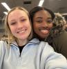 Two female students pose for a selfie.