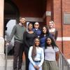 7 students standing on the steps.