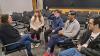 Whitlow meets with a student group after class to discuss their startup around agriculture equipment manufacturing. From left to right: Whitlow, CS majors Alexa Shoop, Joseph Britt, Roderic Parson, and Daniel Arias.