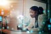 Stock Image of AI and a person looking at it