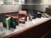 Display case with several brightly colored books open for viewing.