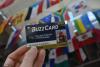 a photo of a BuzzCard in front of the international flags in Smithgall's atrium