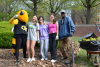 Image of Buzz, students, and Landscape Services employee on Tech Beautification Day.