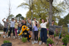 Image of Buzz and students with shovels for Tech Beautification Day.