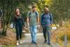 Three graduate students walk on campus together at Georgia Tech.
