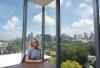 Dean Leslie Sharp in the Library, with a view of the Atlanta skyline through her window. 