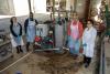 A group of GTRI researchers pose for a photo at a test site. 