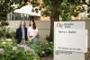 Two GTRI researchers pose for a photo outside of a GTRI facility. 