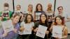 A group of students in Stéphanie Boulard's 'Birds in Arts and Media' VIP show off their new publication, Plumage.