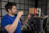 Researcher installing XPAT system in a test chamber