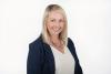 Photo of smiling woman in a business suit
