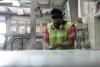 Man sanding a slab of fabricated stone.